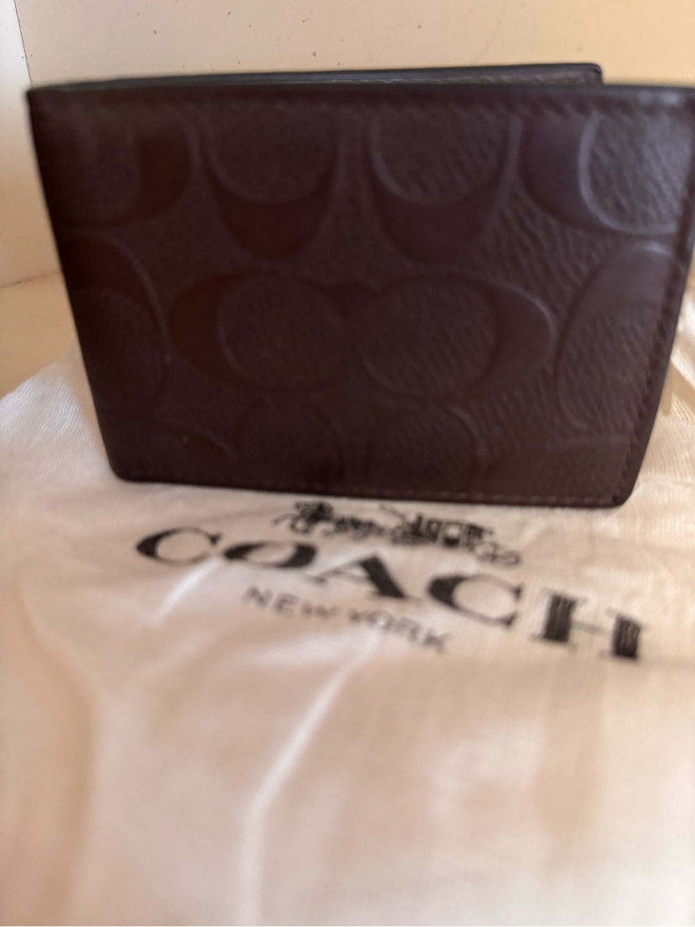 Coach Men’s Brown Signature Embossed Bifold Wallet